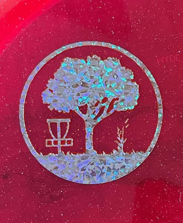Silver Shatter Scarlett Woods Disc Golf Course quarter stamp on a red Metal Flake C-Line MD3.